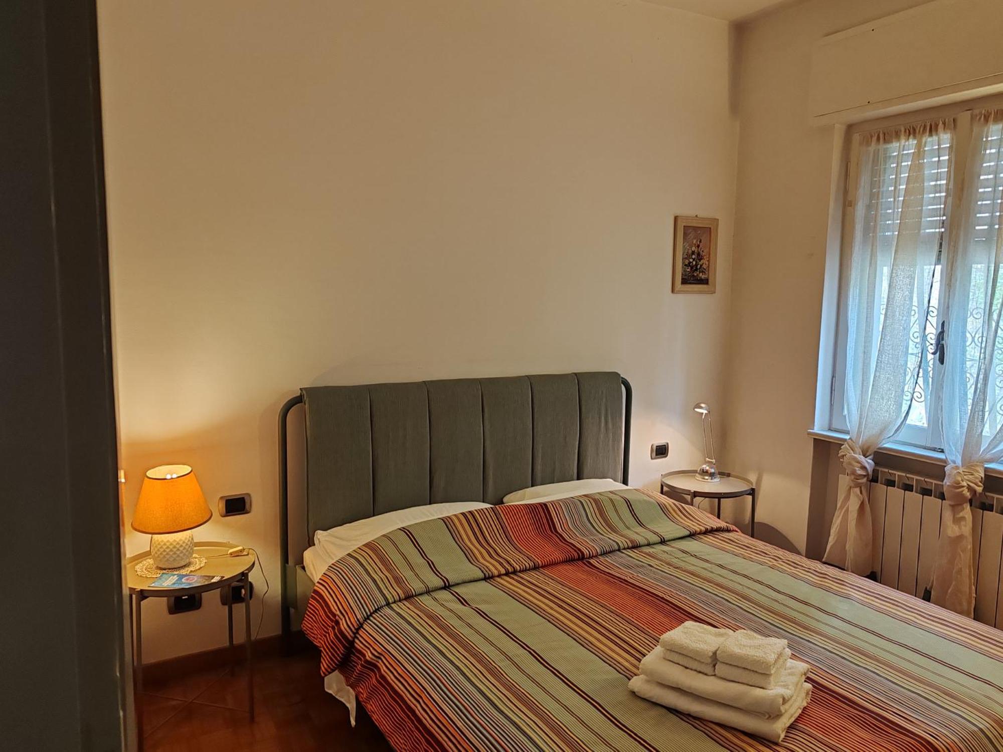 Camera Familiare con Vista Giardino